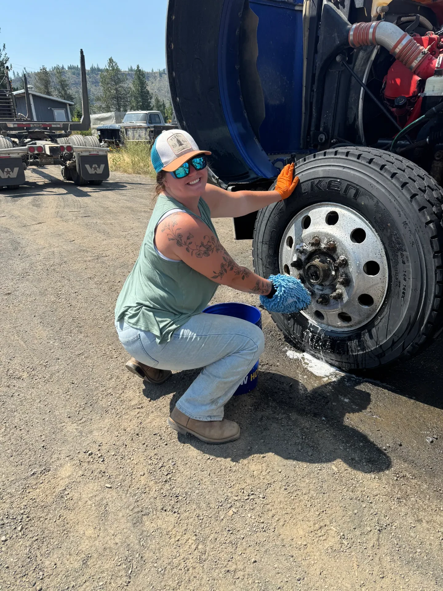 Gem State technician cleaning a commercial truck wheel and tire
